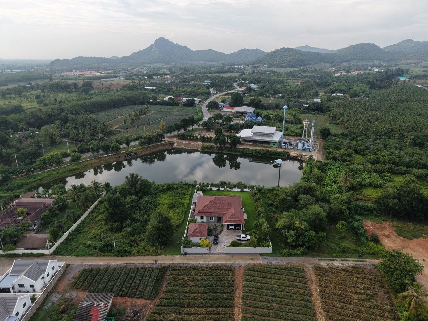 Wide aerial view across Wang Phong toward the Pran Buri mountains