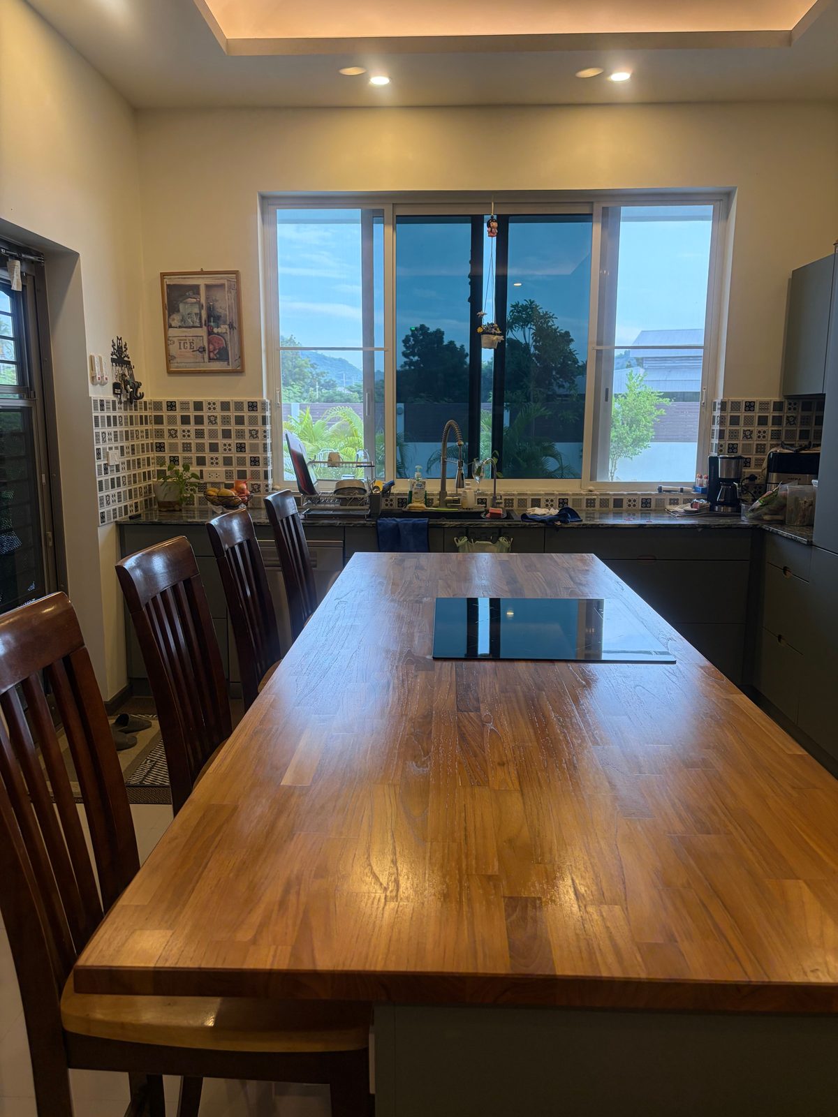 Large kitchen island and dining space in the furnished villa