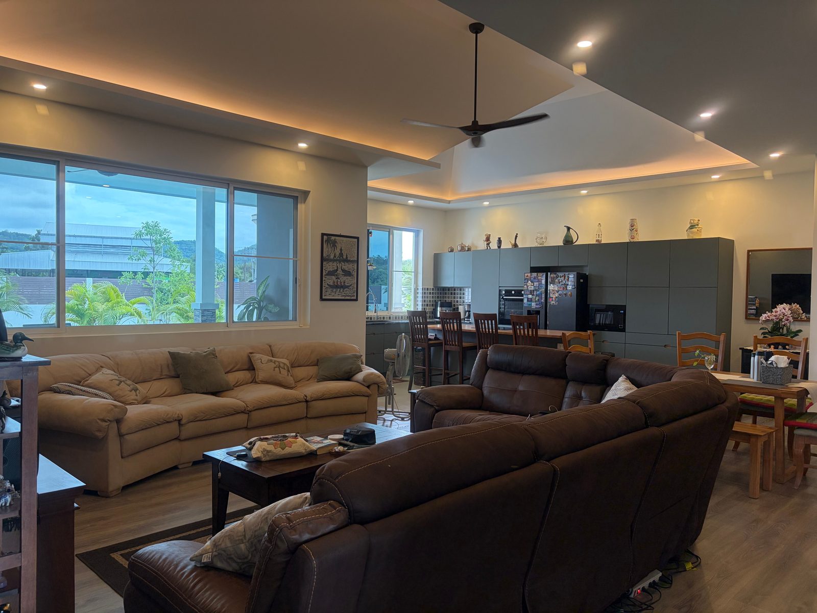 Open-plan living and dining area with garden views