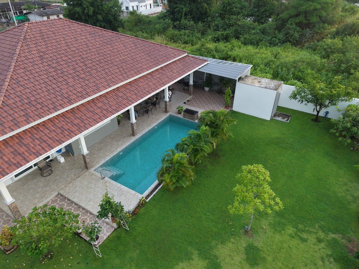 Private swimming pool and landscaped garden at the Wang Phong villa