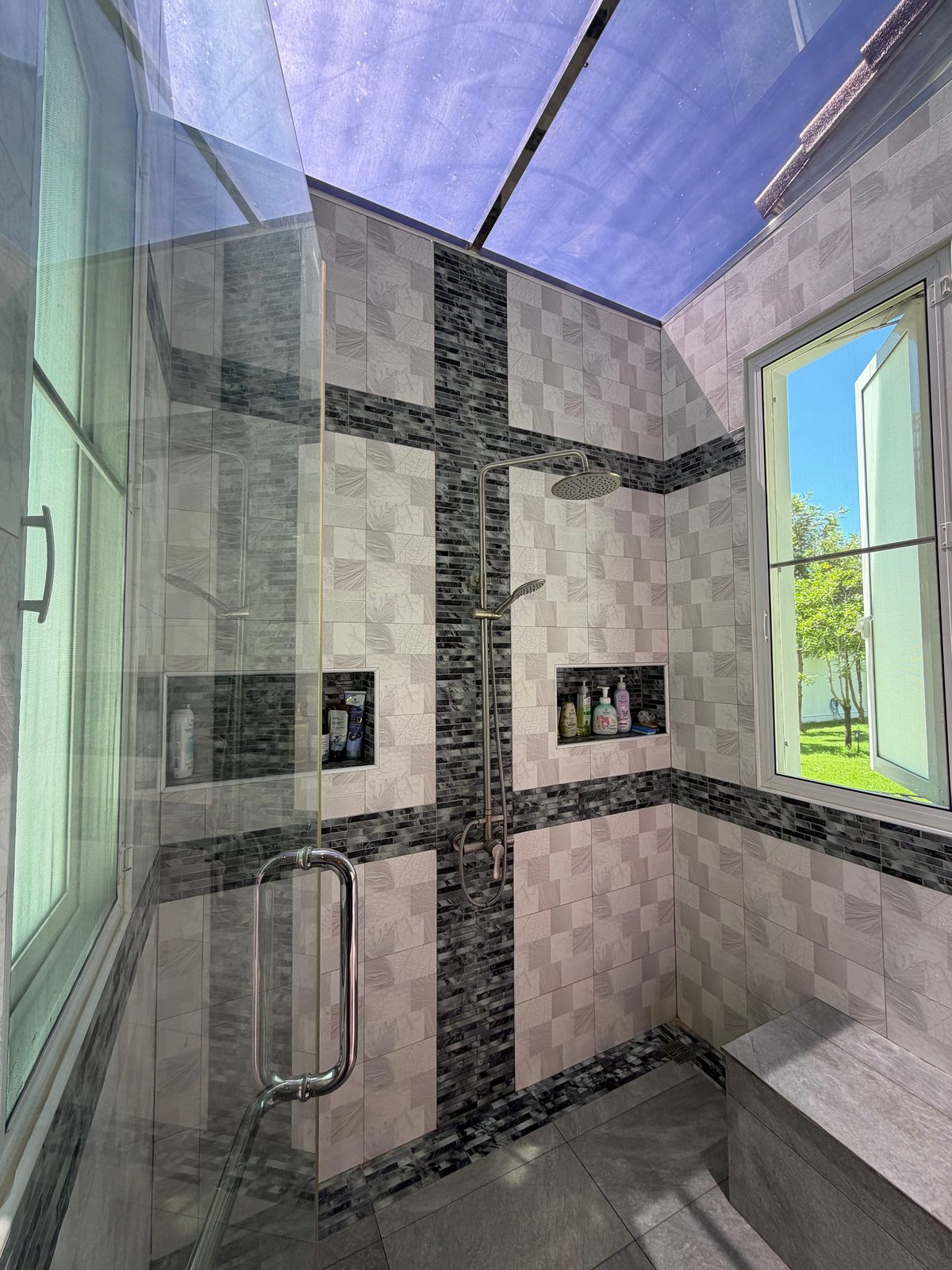 Tiled bathroom with a spacious walk-in shower