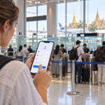 Traveller using Thailand THIM immigration app at an airport